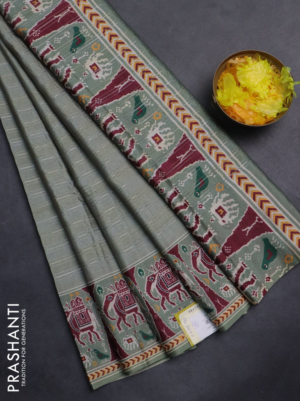 Semi tussar saree pastel green with zari stripes pattern and patola printed border