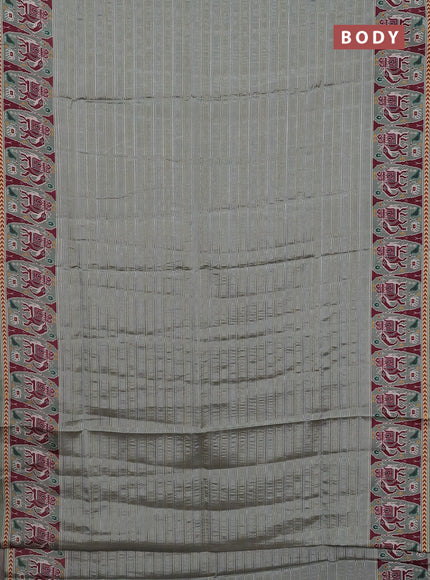 Semi tussar saree pastel green with zari stripes pattern and patola printed border