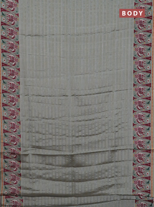 Semi tussar saree pastel green with zari stripes pattern and patola printed border