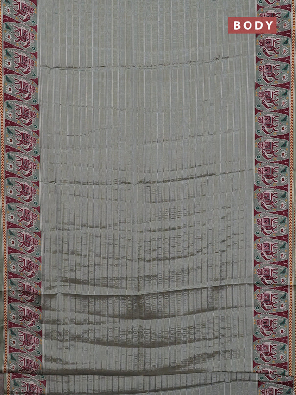 Semi tussar saree pastel green with zari stripes pattern and patola printed border