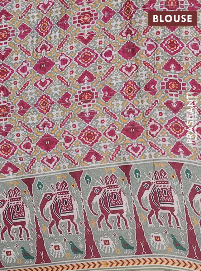 Semi tussar saree pastel green with zari stripes pattern and patola printed border