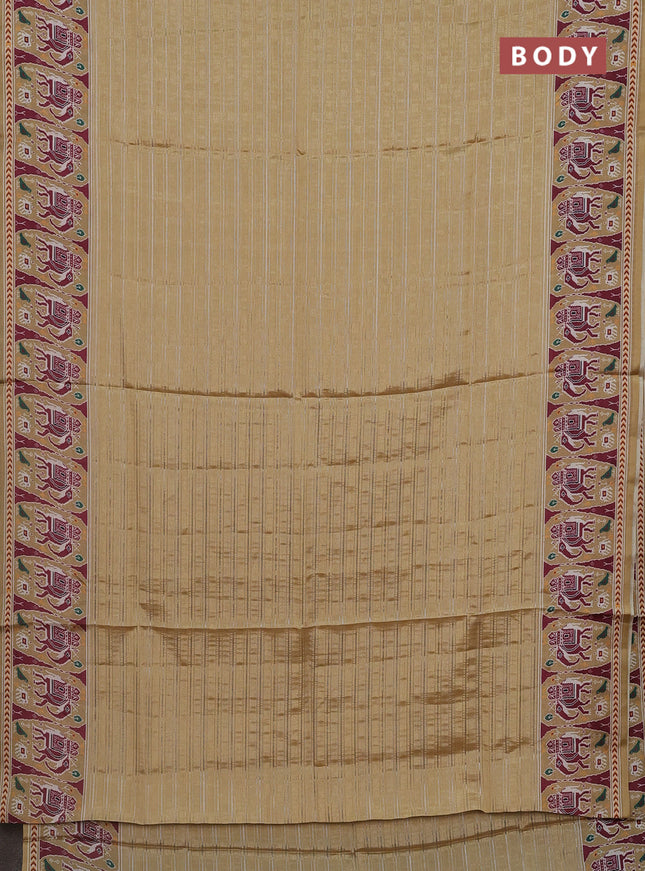 Semi tussar saree sandal with zari stripes pattern and patola printed border