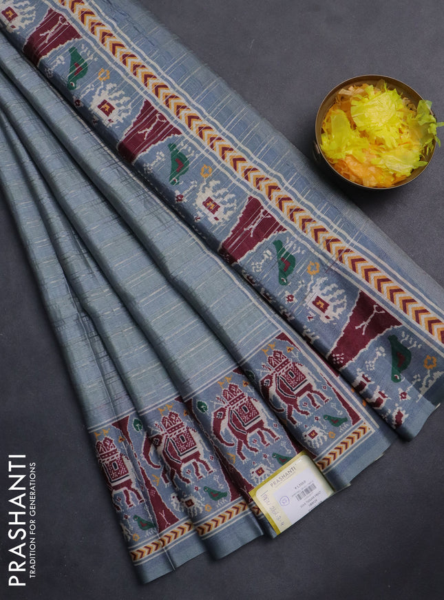 Semi tussar saree pastel grey with zari stripes pattern and patola printed border
