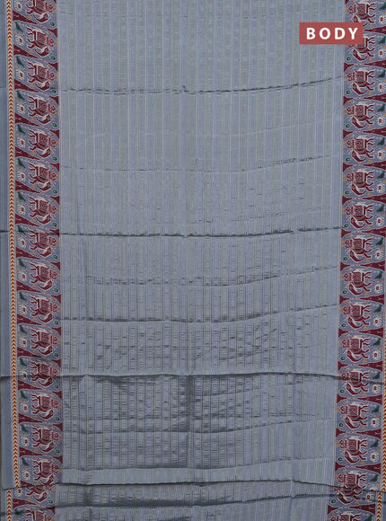 Semi tussar saree pastel grey with zari stripes pattern and patola printed border
