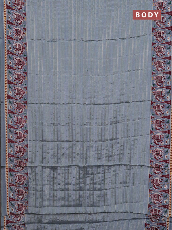 Semi tussar saree pastel grey with zari stripes pattern and patola printed border