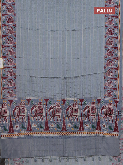 Semi tussar saree pastel grey with zari stripes pattern and patola printed border