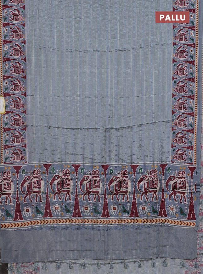 Semi tussar saree pastel grey with zari stripes pattern and patola printed border