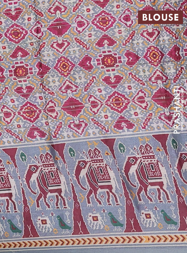 Semi tussar saree pastel grey with zari stripes pattern and patola printed border