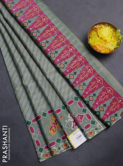 Semi tussar saree pastel green with leheriya prints and patola printed border
