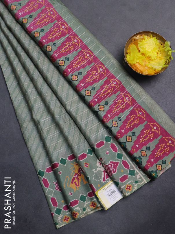 Semi tussar saree pastel green with leheriya prints and patola printed border