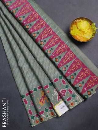 Semi tussar saree pastel green with leheriya prints and patola printed border