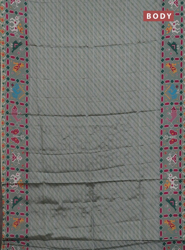 Semi tussar saree pastel green with leheriya prints and patola printed border