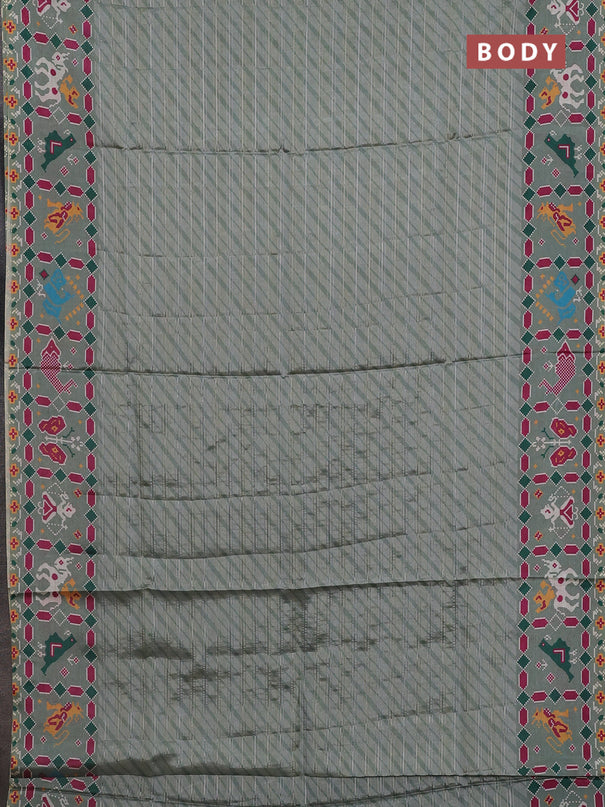 Semi tussar saree pastel green with leheriya prints and patola printed border