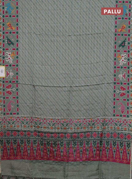 Semi tussar saree pastel green with leheriya prints and patola printed border