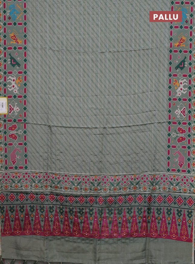 Semi tussar saree pastel green with leheriya prints and patola printed border