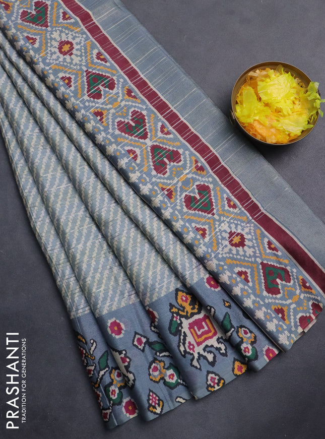 Semi tussar saree pastel grey with leheriya prints and patola printed border