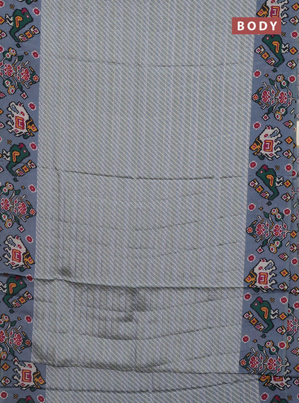 Semi tussar saree pastel grey with leheriya prints and patola printed border