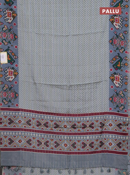 Semi tussar saree pastel grey with leheriya prints and patola printed border