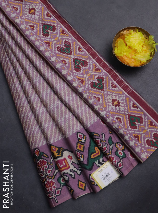 Semi tussar saree pastel pink with leheriya prints and patola printed border