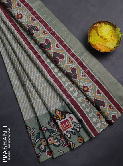 Semi tussar saree pastel green with leheriya prints and patola printed border