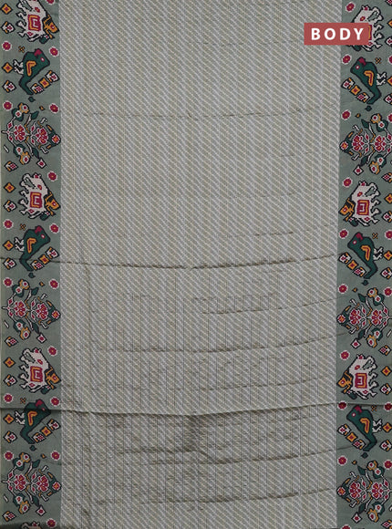 Semi tussar saree pastel green with leheriya prints and patola printed border