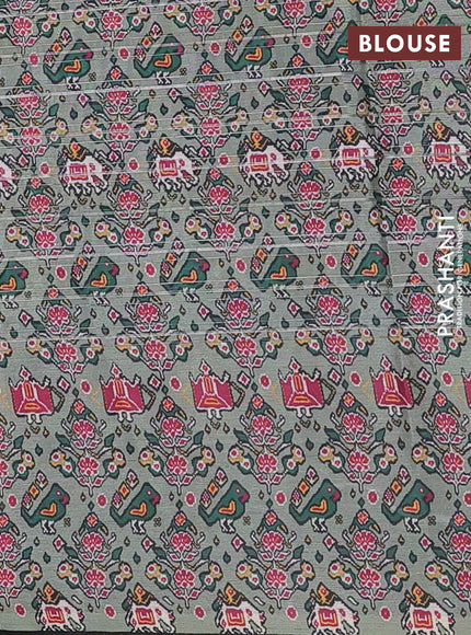 Semi tussar saree pastel green with leheriya prints and patola printed border