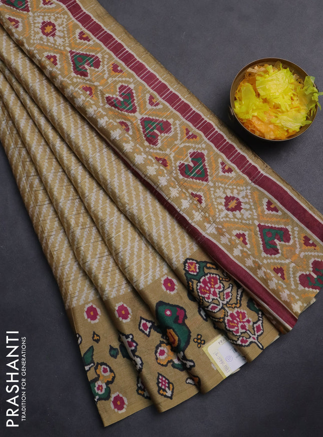Semi tussar saree mustard shade with leheriya prints and patola printed border