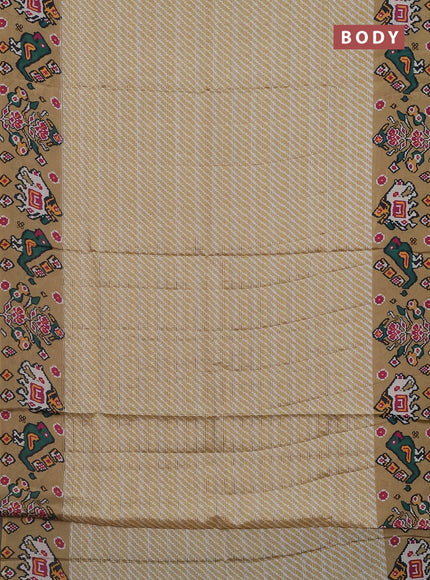 Semi tussar saree mustard shade with leheriya prints and patola printed border