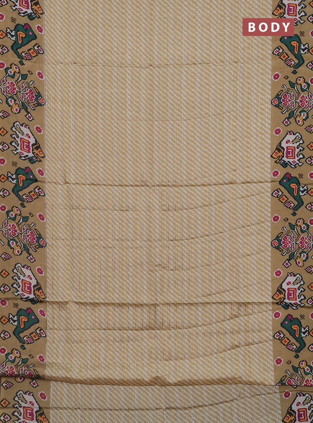 Semi tussar saree mustard shade with leheriya prints and patola printed border