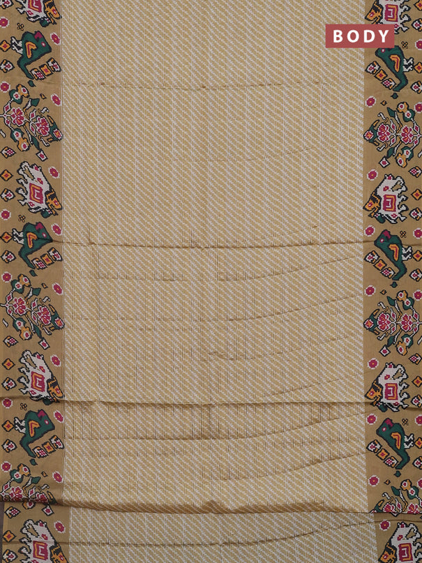 Semi tussar saree mustard shade with leheriya prints and patola printed border