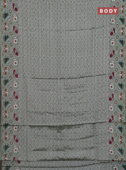 Semi tussar saree pastel green with zari stripes pattern and patola printed border