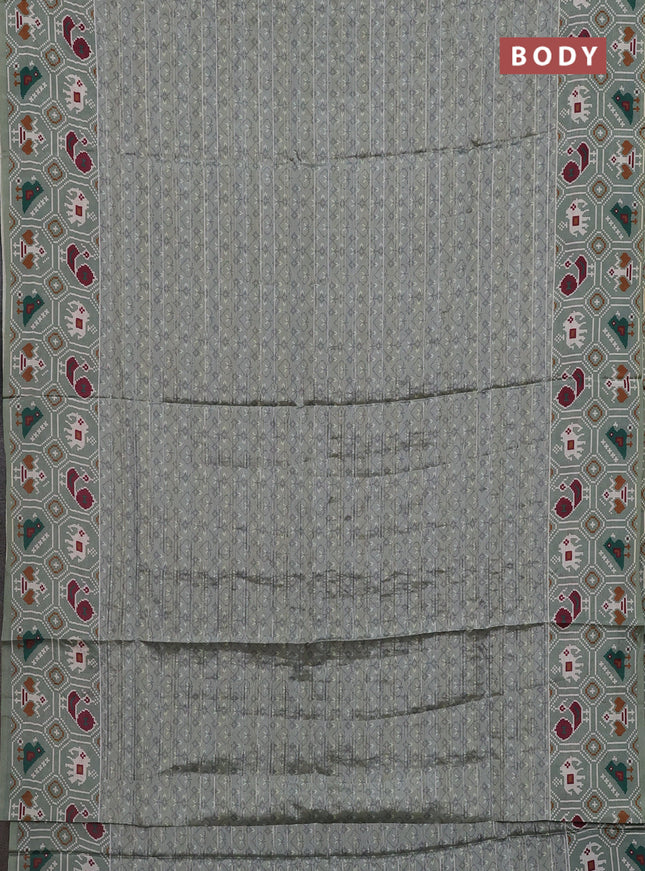 Semi tussar saree pastel green with zari stripes pattern and patola printed border