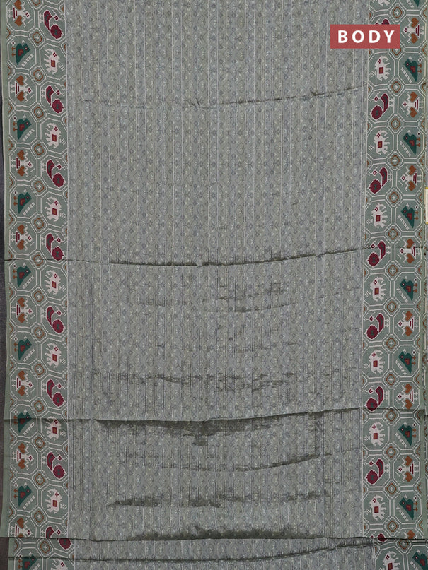 Semi tussar saree pastel green with zari stripes pattern and patola printed border