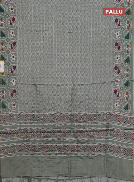 Semi tussar saree pastel green with zari stripes pattern and patola printed border