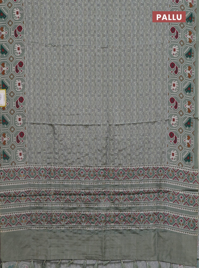 Semi tussar saree pastel green with zari stripes pattern and patola printed border