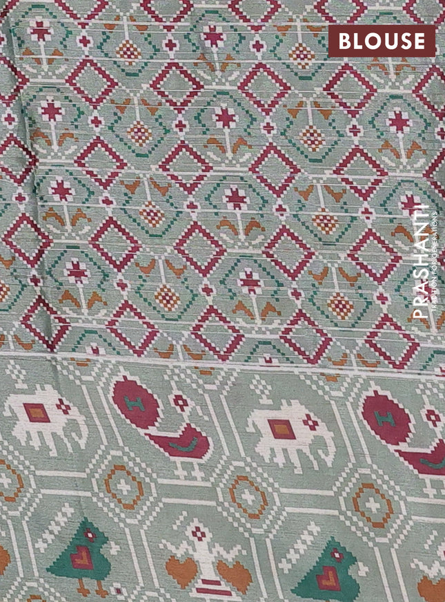 Semi tussar saree pastel green with zari stripes pattern and patola printed border