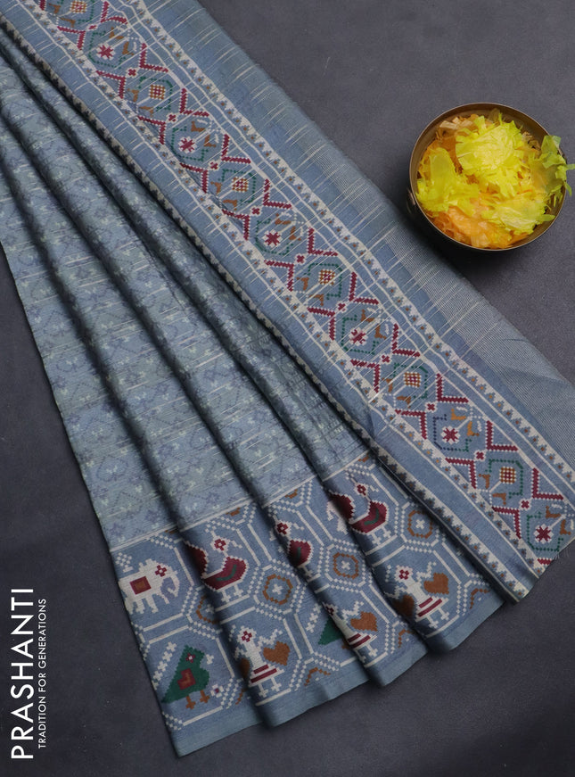 Semi tussar saree grey shade with zari stripes pattern and patola printed border