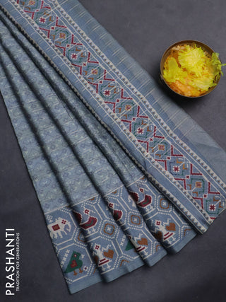 Semi tussar saree grey shade with zari stripes pattern and patola printed border