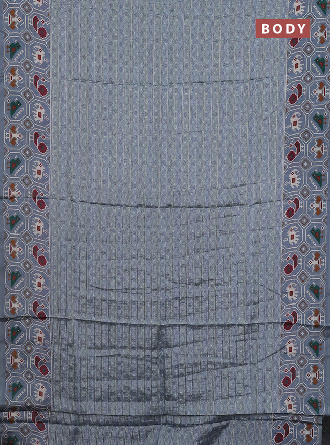 Semi tussar saree grey shade with zari stripes pattern and patola printed border