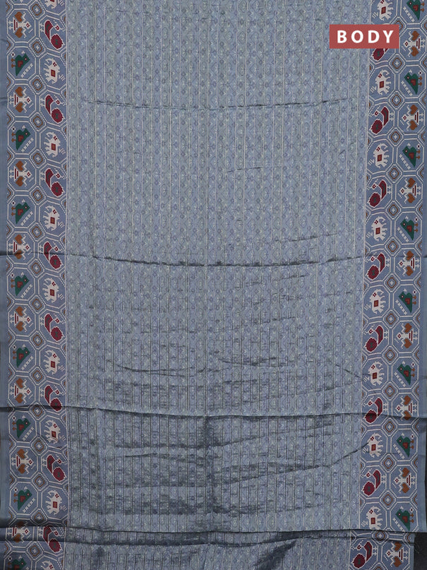 Semi tussar saree grey shade with zari stripes pattern and patola printed border