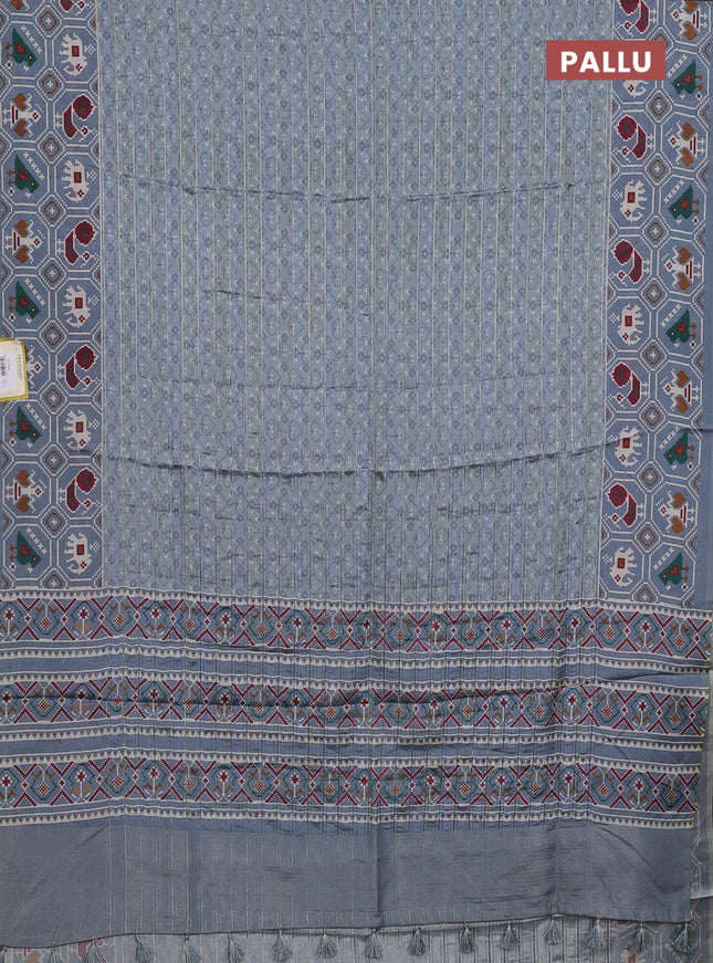 Semi tussar saree grey shade with zari stripes pattern and patola printed border