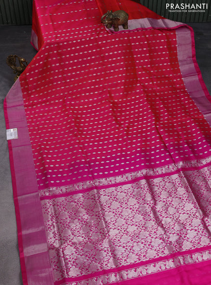 Pure uppada silk saree dual shade of pinkish orange with allover silver zari woven buttas and zari woven border