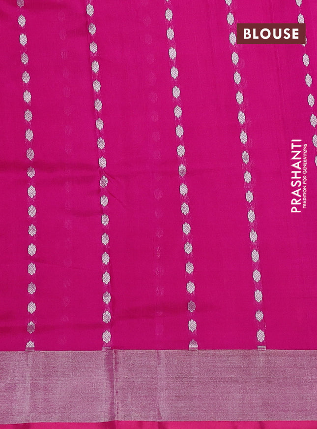 Pure uppada silk saree dual shade of pinkish orange with allover silver zari woven buttas and zari woven border