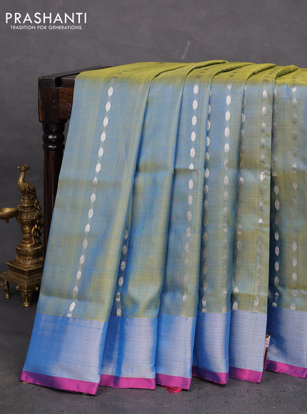 Pure uppada silk saree dual shade of teal blue and pink with allover silver zari woven buttas and zari woven border