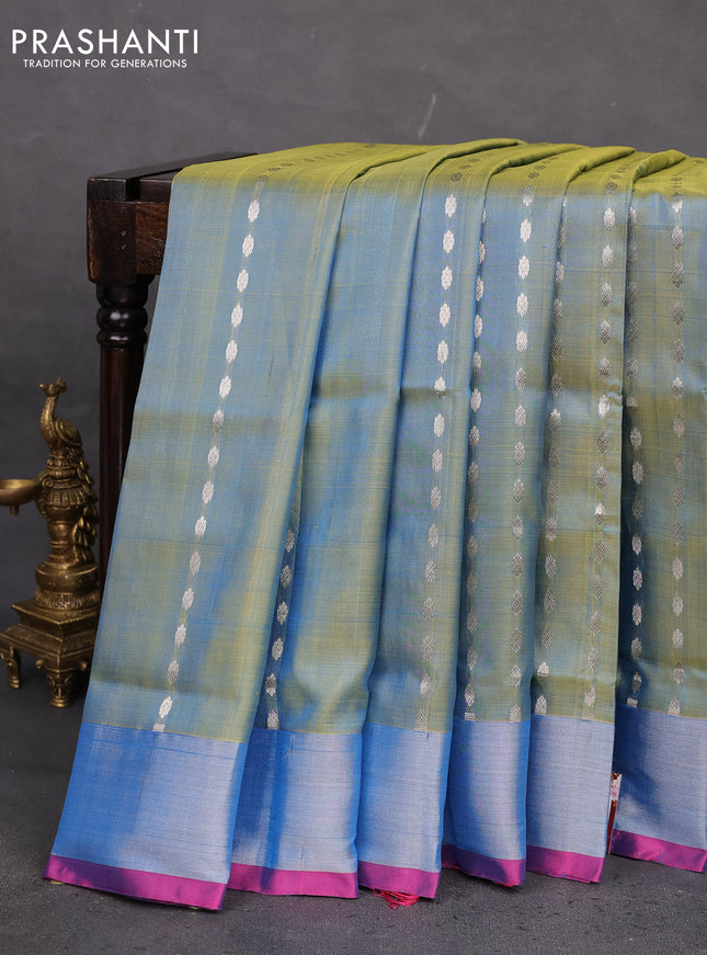 Pure uppada silk saree dual shade of teal blue and pink with allover silver zari woven buttas and zari woven border