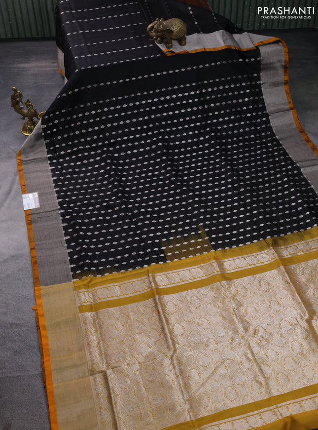 Pure uppada silk saree black and yellow with allover silver zari woven buttas and zari woven border