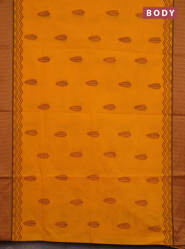 Chettinad cotton saree mango yellow and brown with allover block prints and thread woven border