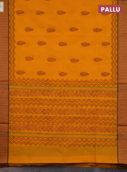 Chettinad cotton saree mango yellow and brown with allover block prints and thread woven border