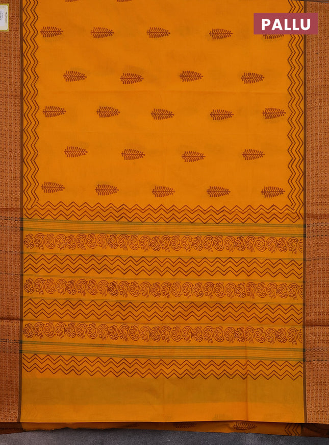 Chettinad cotton saree mango yellow and brown with allover block prints and thread woven border