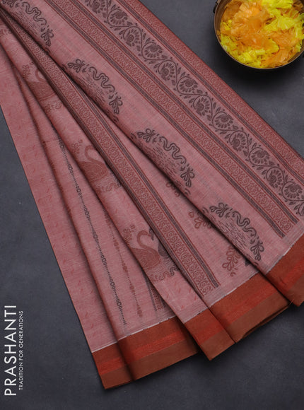 Nithyam cotton saree maroon shade and brown with allover self emboss & thread woven buttas and simple border